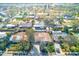 An aerial shot showcasing the neighborhood and the surrounding trees at 4606 W Oakellar Ave, Tampa, FL 33611