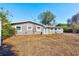 This angle shows the back of the gray house and the large backyard at 4606 W Oakellar Ave, Tampa, FL 33611