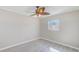 Bedroom featuring wood-look floors, ceiling fan with lights, and bright natural lighting at 4606 W Oakellar Ave, Tampa, FL 33611