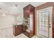 Modern kitchen island featuring stainless steel appliances and granite countertop at 4606 W Oakellar Ave, Tampa, FL 33611