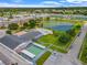 An aerial view showcases the community's pool, lake, and well-maintained green spaces at 5895 18Th N St # 11, St Petersburg, FL 33714