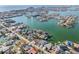 Expansive aerial view of waterfront homes along the coast highlighting serene turquoise waters and coastal community at 619 59Th Ave, St Pete Beach, FL 33706