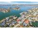 Aerial neighborhood view of waterfront homes, inland waterways, and community in a coastal setting at 619 59Th Ave, St Pete Beach, FL 33706