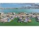 Panoramic aerial view of coastal homes showcasing boating canals, waterfront views, and desirable neighborhood at 619 59Th Ave, St Pete Beach, FL 33706