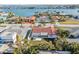 Aerial view of a charming home with a red-tiled roof and spacious backyard, situated by the tranquil waterfront at 619 59Th Ave, St Pete Beach, FL 33706