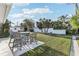 Spacious backyard featuring a patio area and lush green grass at 619 59Th Ave, St Pete Beach, FL 33706