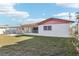 Spacious backyard highlighting the patio and a glimpse of the home's exterior at 619 59Th Ave, St Pete Beach, FL 33706