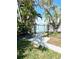 Waterfront home with fenced backyard and scenic views of the canal, offering a tranquil outdoor space at 619 59Th Ave, St Pete Beach, FL 33706