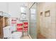 Bathroom showcasing a shower stall, and toilet with neutral tiling at 619 59Th Ave, St Pete Beach, FL 33706