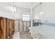 Bathroom shows necessary repairs, featuring a tiled shower, toilet, and exposed framework at 619 59Th Ave, St Pete Beach, FL 33706