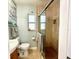 Bathroom featuring a glass-enclosed shower, neutral wall colors and tile flooring at 619 59Th Ave, St Pete Beach, FL 33706