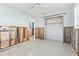 Open bedroom featuring closet, light walls, ceiling fan, and concrete block walls needing repair at 619 59Th Ave, St Pete Beach, FL 33706