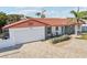 Charming home featuring a red tile roof and well-manicured landscaping at 619 59Th Ave, St Pete Beach, FL 33706