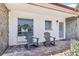 Inviting front porch featuring rocking chairs for relaxing outdoor enjoyment at 619 59Th Ave, St Pete Beach, FL 33706