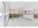 Bright living room featuring sliding glass doors, light flooring and open concept design at 619 59Th Ave, St Pete Beach, FL 33706