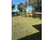 Spacious backyard featuring a lush lawn and a privacy fence at 6223 12Th S St, St Petersburg, FL 33705