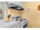 Close up of kitchen featuring white cabinets and an updated range with oven at 6353 Spring Hill Dr, Spring Hill, FL 34606