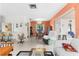 Bright living room with dining area, large windows, and a sliding door to the lanai at 6353 Spring Hill Dr, Spring Hill, FL 34606