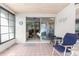 View from the tiled sunroom into the rest of the house through a glass sliding door at 6353 Spring Hill Dr, Spring Hill, FL 34606