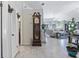 Inviting foyer with tile floors, a grandfather clock, and an open view into the expansive living area at 692 Greenglen Ln, Palm Harbor, FL 34684