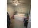 Bedroom featuring a ceiling fan, and a daybed dressed with decorative pillows at 6954 Hawthorne Trace Ln, Riverview, FL 33578