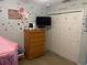 bedroom featuring polka-dot decorations and TV at 6954 Hawthorne Trace Ln, Riverview, FL 33578