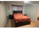 Bedroom with a king-sized bed, carpet, and two bedside tables at 6954 Hawthorne Trace Ln, Riverview, FL 33578