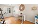 Bright dining space with bamboo floors and a modern table set at 6980 Avenue Des Palais # 2A, South Pasadena, FL 33707