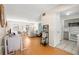 Bright living room and kitchen showcasing an open floor plan and lots of natural light at 6980 Avenue Des Palais # 2A, South Pasadena, FL 33707