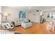 Cozy living room with bamboo floors, seating, and a ceiling fan at 6980 Avenue Des Palais # 2A, South Pasadena, FL 33707