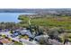 Aerial view of homes near water surrounded by lush greenery at 714 Lemonwood Dr, Oldsmar, FL 34677