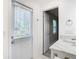 Bright bathroom featuring outside access, marble countertops, and modern fixtures at 714 Lemonwood Dr, Oldsmar, FL 34677