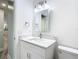 The bathroom features a marble vanity top, modern fixtures, and bright lighting at 714 Lemonwood Dr, Oldsmar, FL 34677