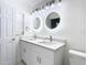 Bathroom features a double sink vanity, attractive mirrors, and modern fixtures at 714 Lemonwood Dr, Oldsmar, FL 34677