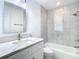 The bathroom features a marble vanity top, a soaking tub, and modern fixtures at 714 Lemonwood Dr, Oldsmar, FL 34677