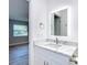 Elegant bathroom featuring marble countertops and modern fixtures at 714 Lemonwood Dr, Oldsmar, FL 34677