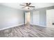 Bright bedroom with wood-look floors and a closet at 714 Lemonwood Dr, Oldsmar, FL 34677