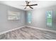 The bedroom has recessed lighting, gray walls, and stylish gray flooring at 714 Lemonwood Dr, Oldsmar, FL 34677