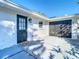 Exterior view of the home with a black front door, welcome mat and access to garage at 714 Lemonwood Dr, Oldsmar, FL 34677