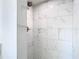 Stylish shower with white marble tile at 714 Lemonwood Dr, Oldsmar, FL 34677