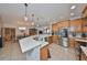 Modern kitchen with a large island, stainless steel appliances, and a seamless flow into the adjacent dining area at 7325 S Trask St, Tampa, FL 33616