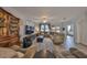 Comfortable living room featuring a large sectional sofa, modern entertainment center, and plenty of natural light at 7325 S Trask St, Tampa, FL 33616