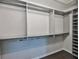 Walk-in closet featuring shelving and rods for storage at 7325 S Trask St, Tampa, FL 33616