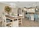 Elegant dining area showcasing a large table, stylish lighting, and an open layout connecting to the modern kitchen at 7426 Sungold Meadow Ct, Apollo Beach, FL 33572