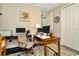 Bright home office featuring a wooden desk, neutral chair, and welcoming decor at 7426 Sungold Meadow Ct, Apollo Beach, FL 33572