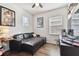 Bedroom with black leather sofa and pop culture themed decorations at 7645 Windchase Way, Wesley Chapel, FL 33545