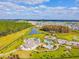 Aerial view of the community park featuring a playground, pool, and well-manicured green spaces at 7645 Windchase Way, Wesley Chapel, FL 33545