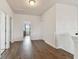 Upstairs hallway featuring wood floors and neutral paint at 7645 Windchase Way, Wesley Chapel, FL 33545