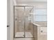 Tiled shower and soaking tub in Primary bathroom at 7645 Windchase Way, Wesley Chapel, FL 33545