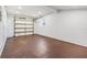 Spacious garage interior with a window for natural light, and a functional overhead door at 8705 Tahiti Ln, Tampa, FL 33615